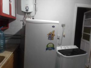 a refrigerator in a kitchen with stickers on it at كمب شيزار ادفو 35 in Alexandria