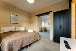 Katil atau katil-katil dalam bilik di Residence La Corte - Bilocale 4