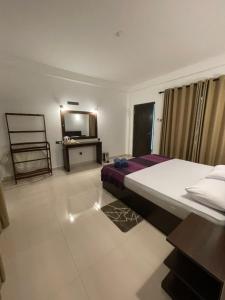 Letto o letti in una camera di Sigiri Shen Residence