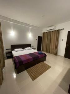 Letto o letti in una camera di Sigiri Shen Residence