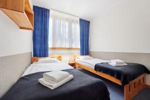 Posteľ alebo postele v izbe v ubytovaní Ośrodek Wczasowy PANORAMA Szczyrk