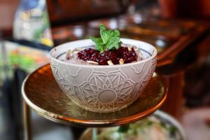 a bowl of food sitting on a table at Hotel Kamélia in Žilina