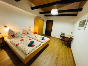 Posteľ alebo postele v izbe v ubytovaní Penzion Familia Antol