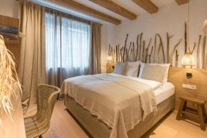 a bedroom with a large bed and a window at Magazin Rooms in Salzburg
