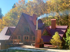 a house with a chimney on top of it at Voronins Retreat House in Lumshory