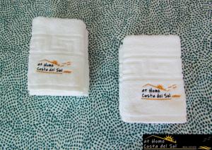 two towels with the words an that everyhilldayhillselfself kill at Apartamento en el centro de Nerja by At Home Costa del Sol in Nerja