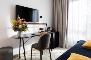TV a/nebo společenská místnost v ubytování Antares Hotel
