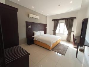 Postel nebo postele na pokoji v ubytování Asfar Hotel Apartments + 36 fotografií