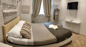 Postel nebo postele na pokoji v ubytování Vaticano San Pietro metro ottaviano