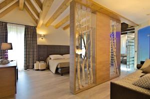 Posteľ alebo postele v izbe v ubytovaní Il Piccolo Dolomiti Resort