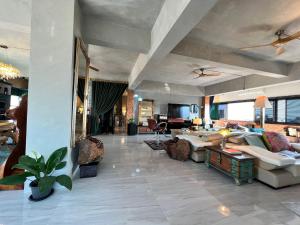 a living room with a couch and a table at Luxury Apartment in Nimman, 5 mins to Maya in Chiang Mai