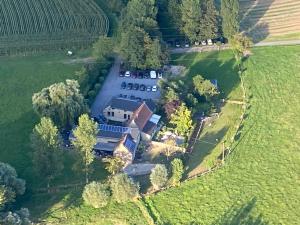 an aerial view of a large house in a field at La Roulotte de Papou - 2 adultes & 1 enfant in Frasnes-lez-Anvaing