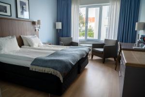 Postel nebo postele na pokoji v ubytování Marstrands Havshotell + 24 fotografií