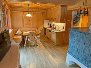 a kitchen with a table and a dining room at Alkira in Sankt Anton am Arlberg
