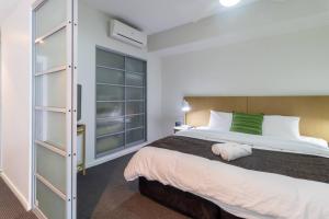 Voodi või voodid majutusasutuse Harbour View Apartment On 11th Floor King Bed toas