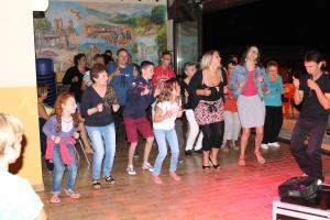 a group of people standing in front of a crowd at Camping Le Pré Cathare in Lavelanet