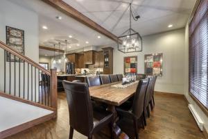 a dining room with a wooden table and chairs at 17 Village Walk Sun Peaks BC in Sun Peaks