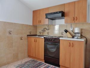 Kuchyňa alebo kuchynka v ubytovaní Apartments Makic