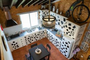 an overhead view of a kitchen with a sink and a table at Azores Cow House in Calhetas