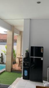 Postel nebo postele na pokoji v ubytování Chua Guest house Canggu