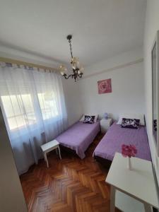 Ένα ή περισσότερα κρεβάτια σε δωμάτιο στο Apartment Rose +9 φωτογραφίες