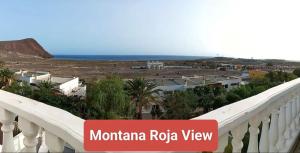 a balcony with a view of the ocean at Magic view facing MontanaRoja in La Tejita +15 photos