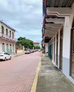 a city street with cars parked on the side of a building at Casa Vintage in Panama City