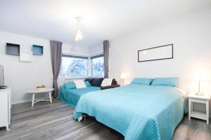 Postel nebo postele na pokoji v ubytování Nordurey Guesthouse + 15 fotografií