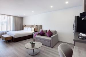 Postel nebo postele na pokoji v ubytování Hotel Jazz Apartments