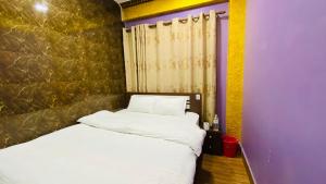 Postel nebo postele na pokoji v ubytování SN Guest House