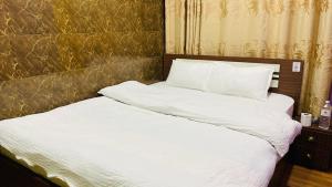 Postel nebo postele na pokoji v ubytování SN Guest House