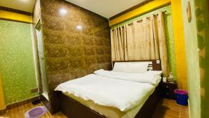 Postel nebo postele na pokoji v ubytování SN Guest House