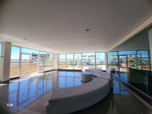 a swimming pool in a large building with a swimming pool at C1-7G Executive Studio with pool , 8boulevard Mactan Newtown in Lapu Lapu City