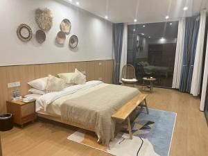 Postel nebo postele na pokoji v ubytování Yuan Meng Town