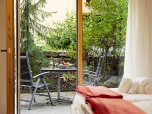 een tafel met een fruitschaal op een patio bij Apartment Rütschi-1 by Interhome in Zermatt