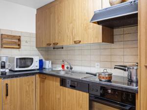 Kuchyň nebo kuchyňský kout v ubytování Apartment Alba by Interhome