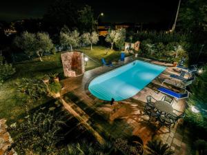 an overhead view of a swimming pool in a yard at night at Holiday Home Rêve d'Or by Interhome in Citta' Sant'Angelo
