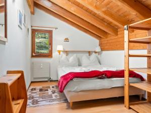 a bedroom with a large bed with a wooden ceiling at Apartment Aragon F130 by Interhome in Ernen
