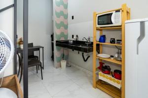 Kuchyň nebo kuchyňský kout v ubytování Studio equipado na area central com Wi-Fi
