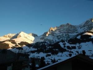 a view of a snow covered mountain range at Apartment Bärgchutzli 1- Stock by Interhome in Adelboden
