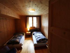 Postel nebo postele na pokoji v ubytování Apartment Lena- Chalet by Interhome