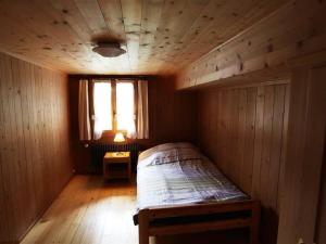 Postel nebo postele na pokoji v ubytování Apartment Lena- Chalet by Interhome