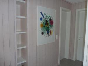 a wall with a painting of fruit on it at Apartment Suzanne Nr- 18 by Interhome in Gstaad +11 photos