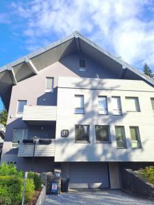 a building with the letter e on it at Apartman Harrachov - Resident in Harrachov