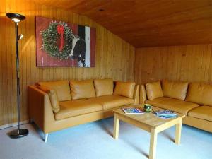 a living room with a couch and a coffee table at Apartment Chalet Heureka-Horbis by Interhome in Engelberg