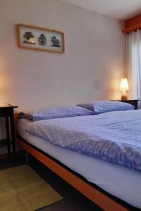 Postel nebo postele na pokoji v ubytování Apartment Stöckli Studio by Interhome