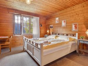 Postel nebo postele na pokoji v ubytování Chalet Arche by Interhome