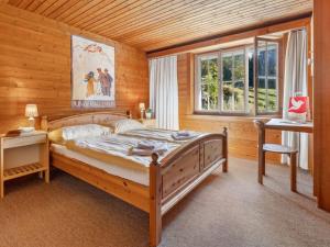 Postel nebo postele na pokoji v ubytování Chalet Arche by Interhome