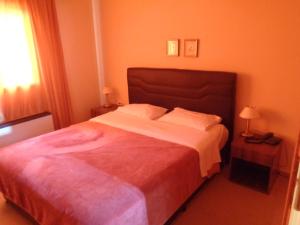 Ένα ή περισσότερα κρεβάτια σε δωμάτιο στο Ξενοδοχείο Bell Air