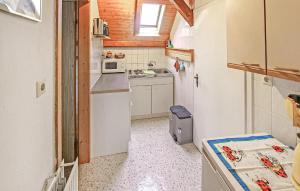 a small kitchen with a sink and a microwave at Stunning Apartment In Königs Wusterhausen Ot in Kablow